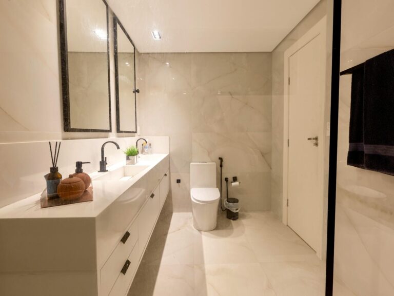 Stylish bathroom with dual sinks and contemporary decor in Salvador, Brazil.